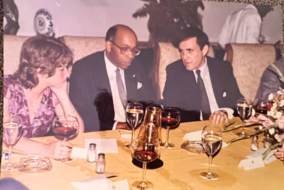 Rudy Giuliani and Renee Szybala sit with George Crockett Jr at the state dinner in Haiti.